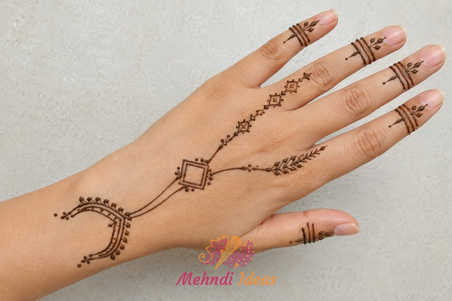 Arabic Henna Design with arched linear ornament on back hand