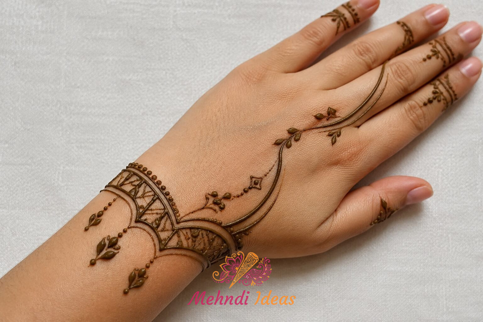 Arabic Henna Design with carved wrist band and flowing lines on back hand