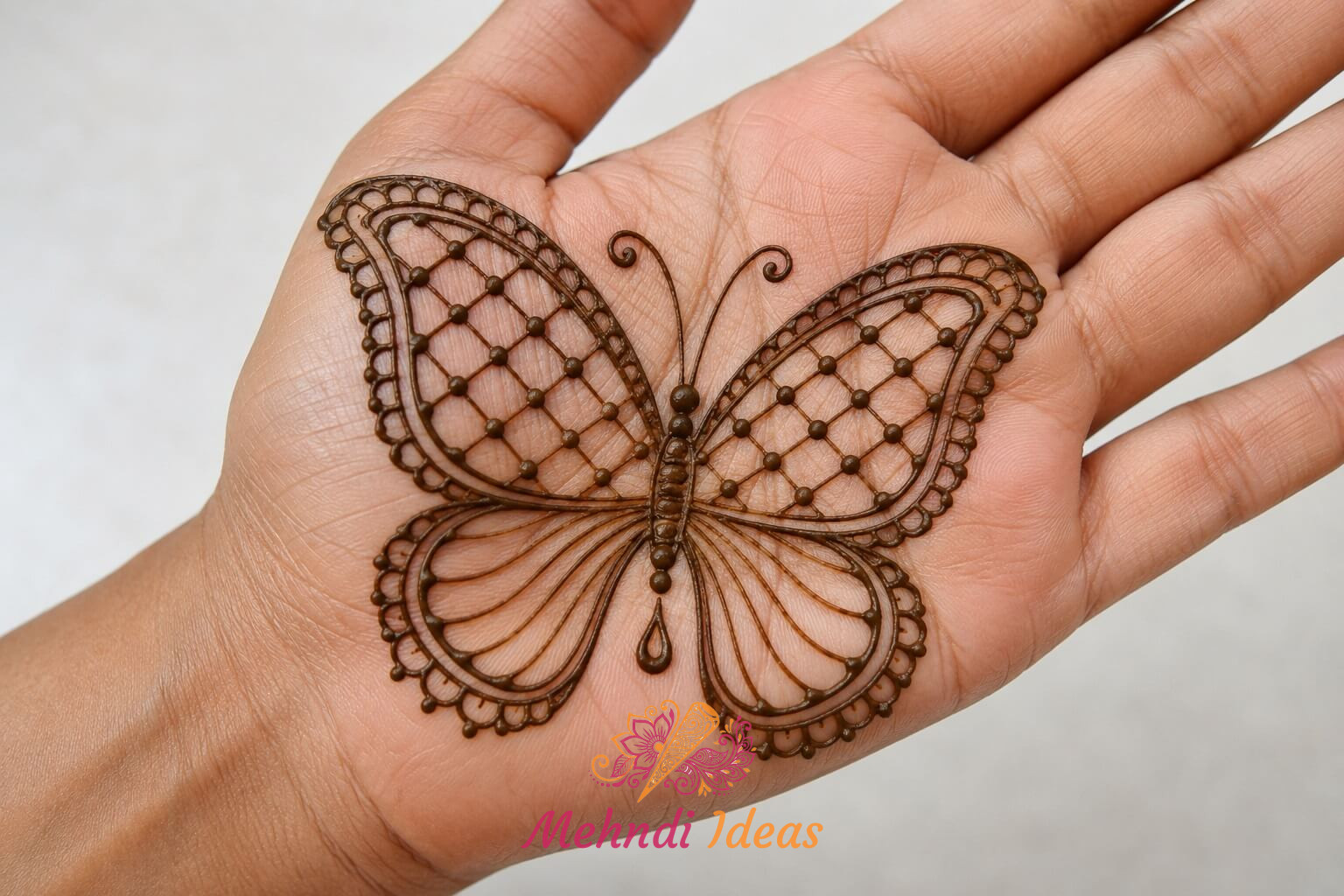 Butterfly Mehndi Design with delicate lattice wings on front hand