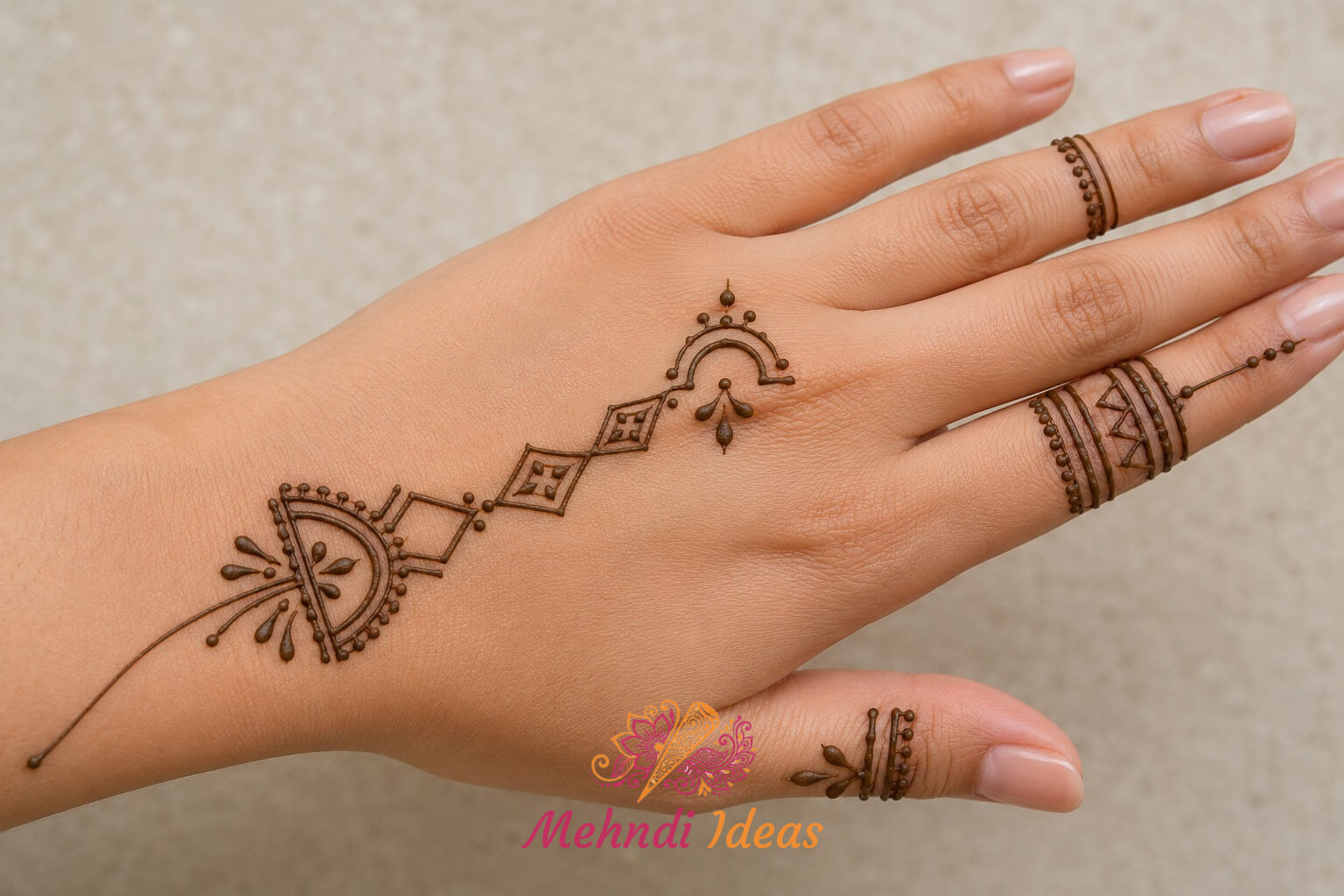 Arabic Henna Design with open angular festive accents on back hand