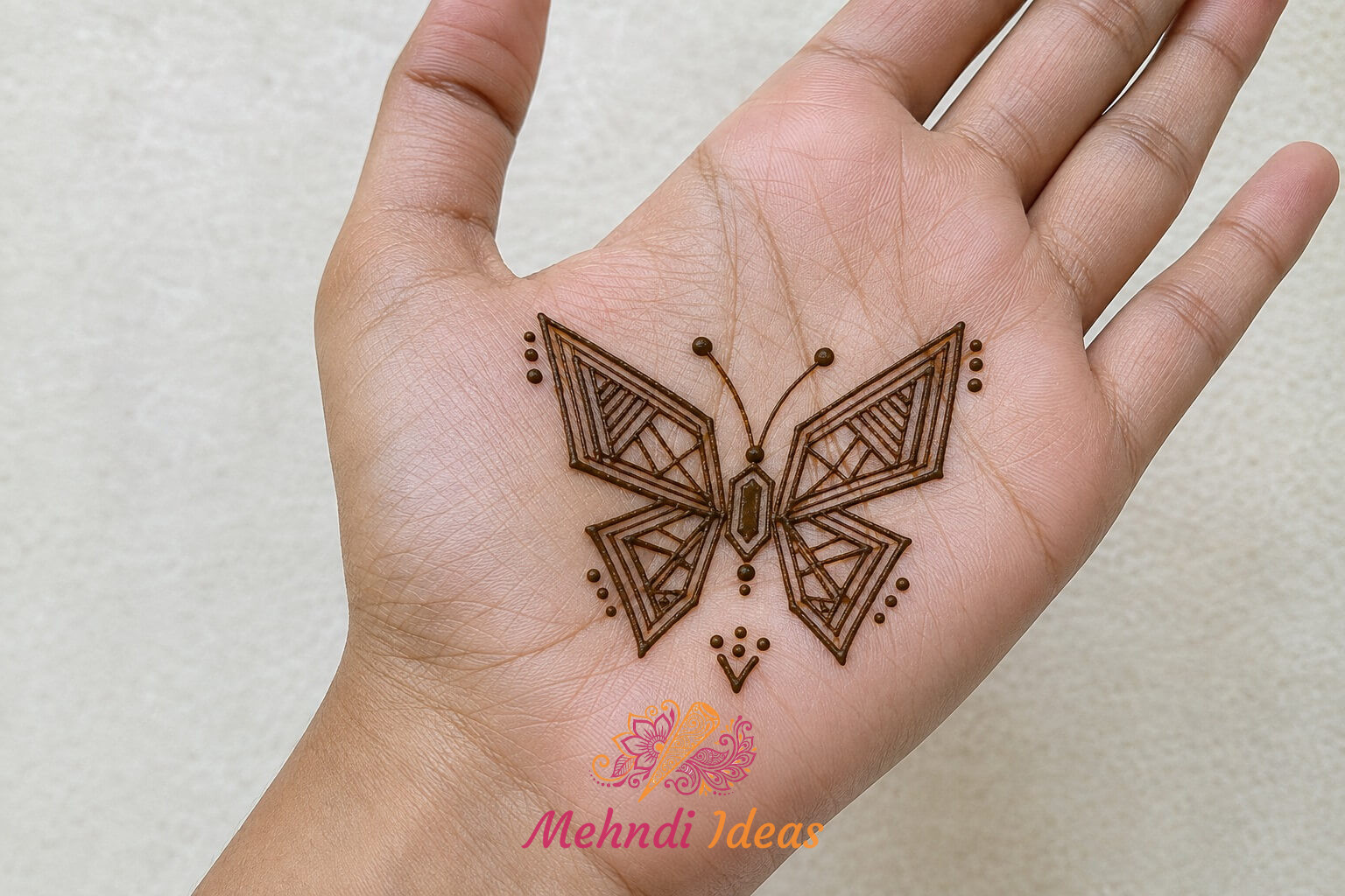 Easy Butterfly Mehndi Design with geometric wings on front hand