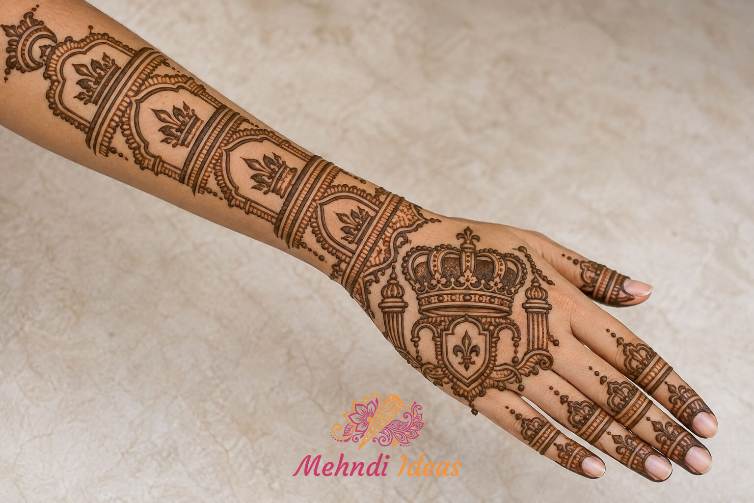 royal back hand mehndi design with crown emblem and extended forearm pattern